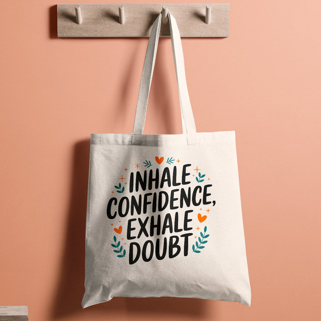 Motivational tote bag with the quote 'Inhale Confidence, Exhale Doubt' and decorative elements.