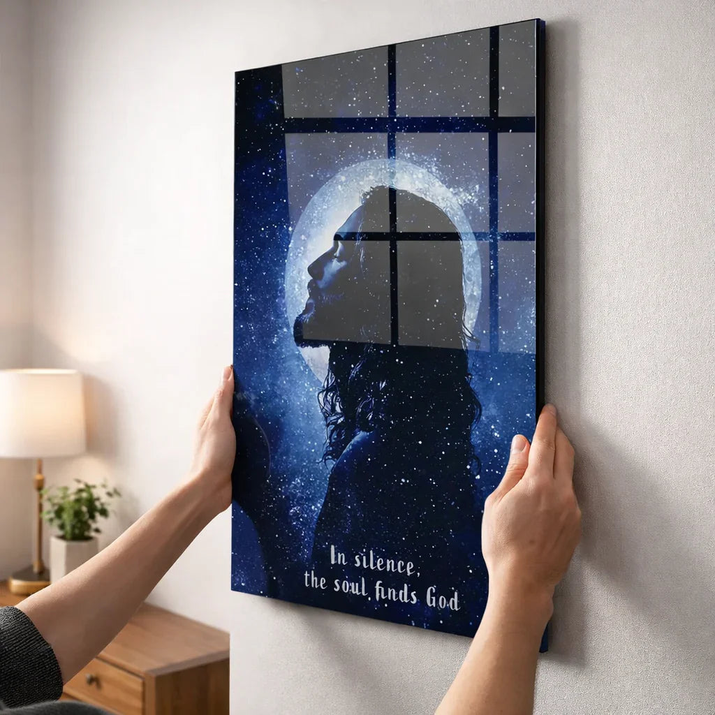 Glass wall art featuring a starry night silhouette of a man with halo and inspirational quote.